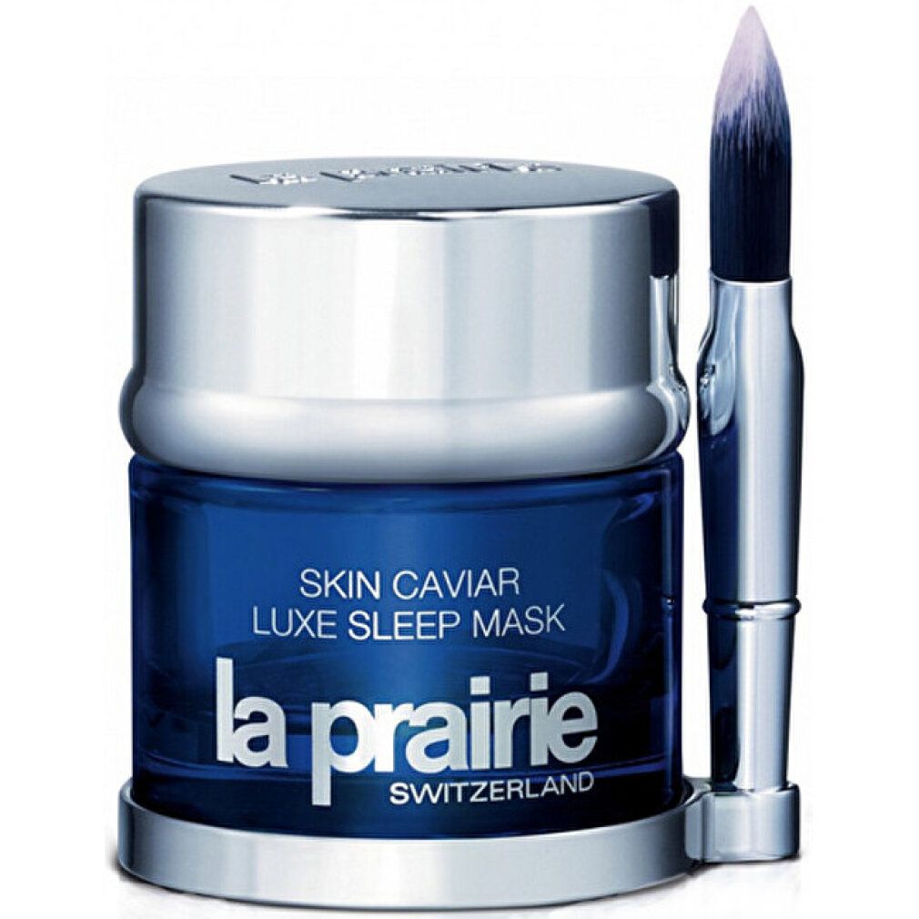 Blauwe pot met zilveren deksel en borstel. Opschrift: Skin Caviar, La Prairie. Borstel met blauwe steel.