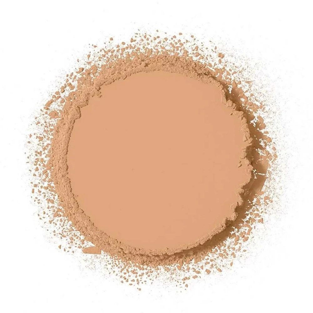 Lichte, ronde poeder, omringd door losse poeder, op witte achtergrond.