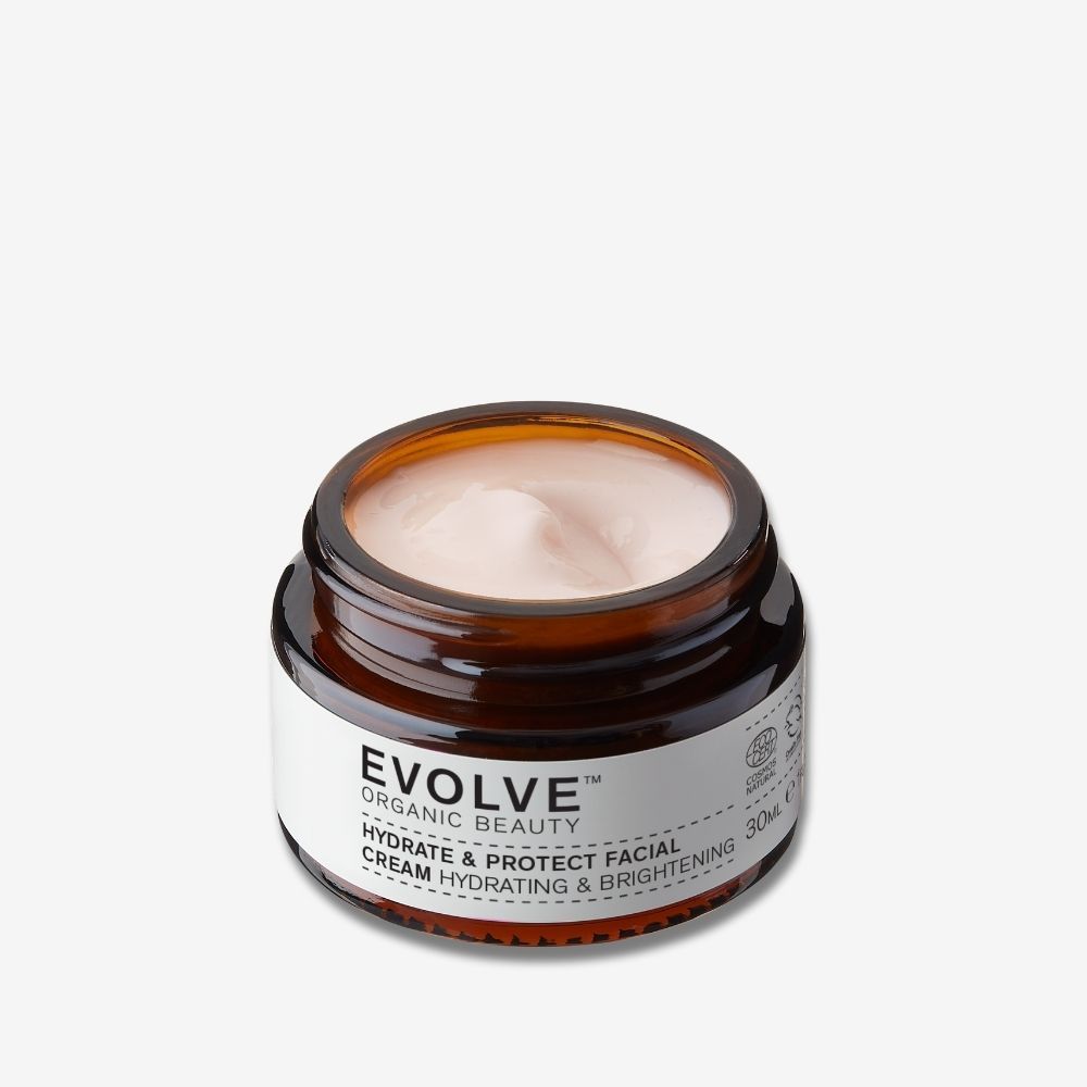 Bruine glazen crème pot met wit etiket. Bevat EVOLVE ORGANIC BEAUTY HYDRATE & PROTECT FACIAL CREAM.