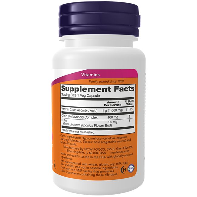 Flacon blanc, bouchon violet. Étiquette avec informations sur la vitamine C. Inscription: NOW FOODS. Contient 1000 mg de vitamine C.