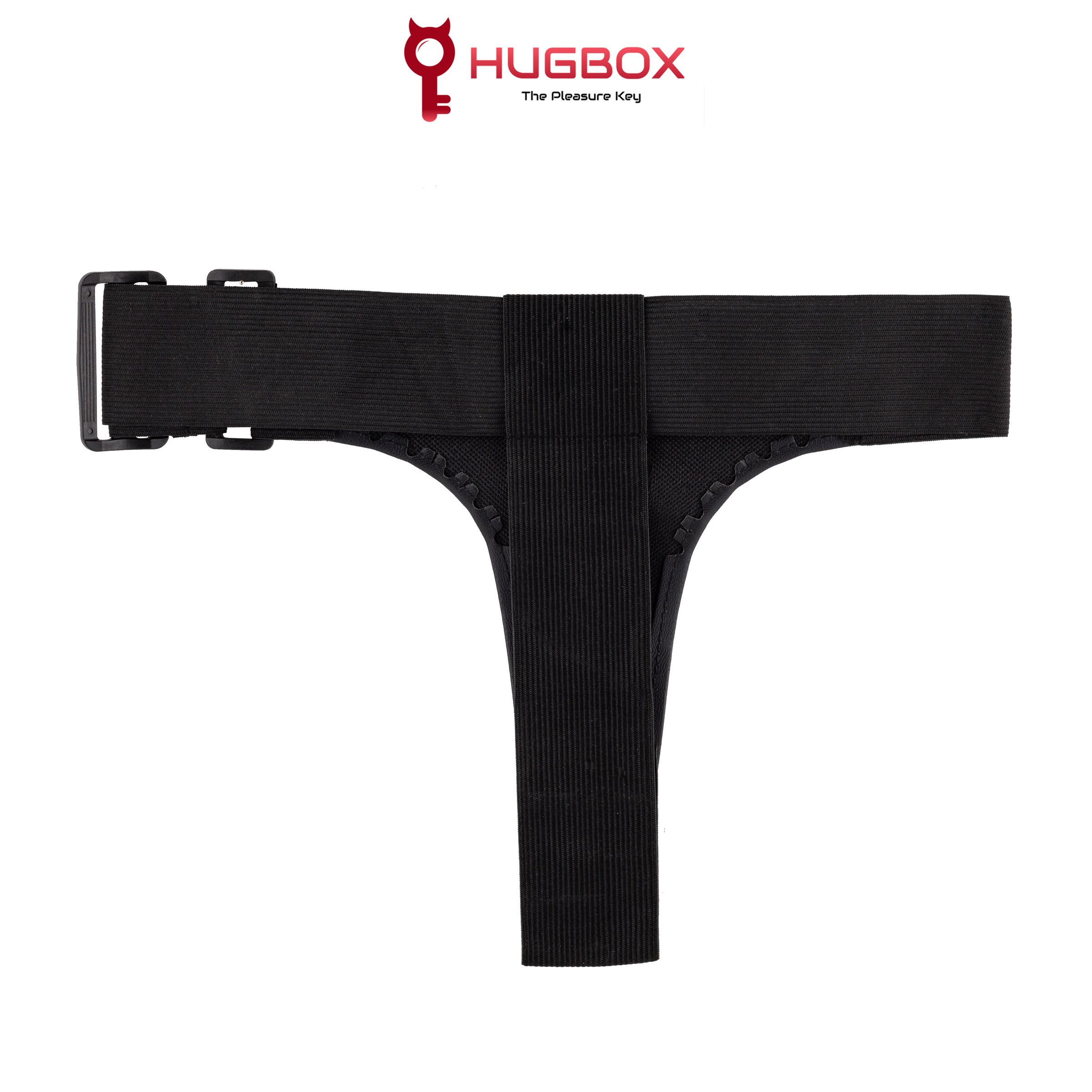 Accessoire intime noir en forme de T. Bande élastique avec fermeture réglable. Logo HUGBOX en haut.