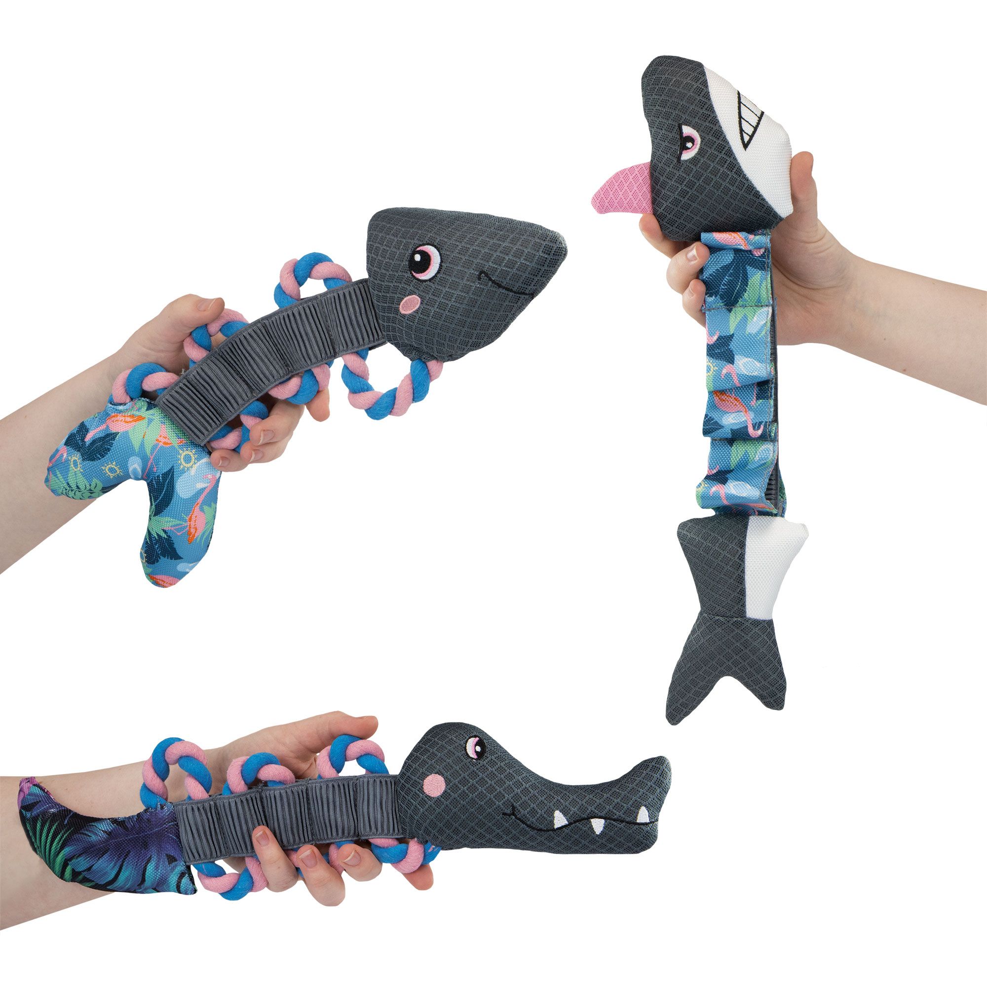 Trois jouets: crocodile, poisson et poisson avec langue. Tous avec cordes et éléments fleuris.