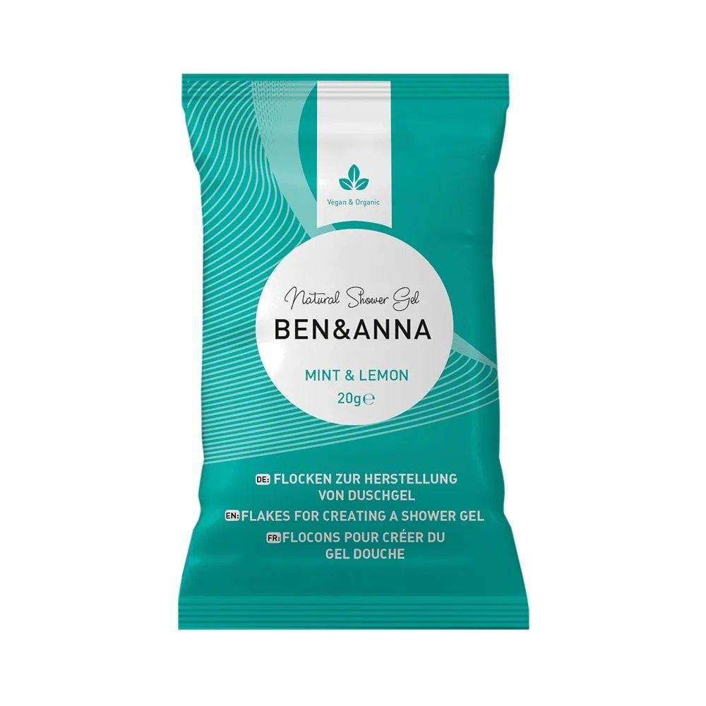 Sachet turquoise avec bande blanche. Inscription : Ben & Anna, Mint & Lemon, gel douche naturel. Contient des flocons.