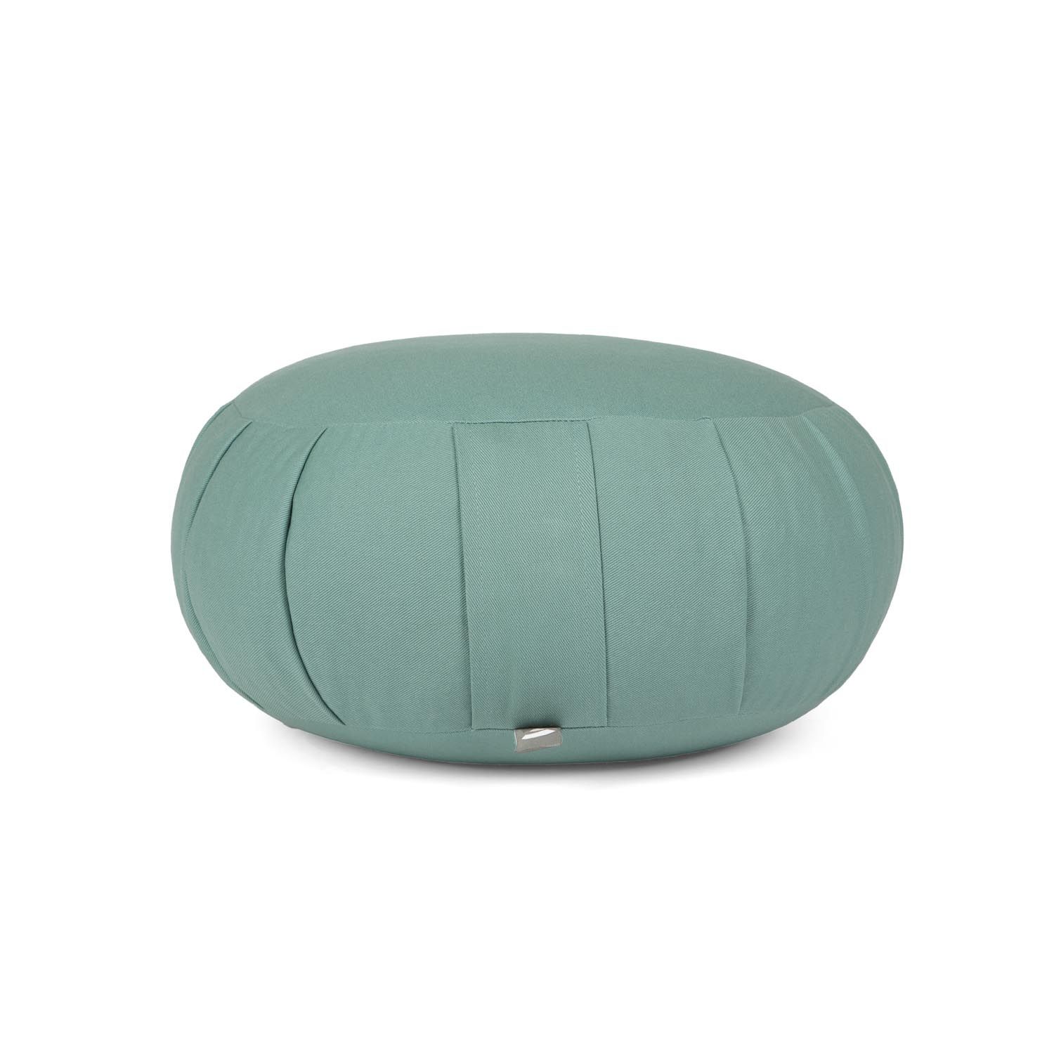 Coussin de méditation rond vert menthe, plis verticaux. Petite étiquette latérale.