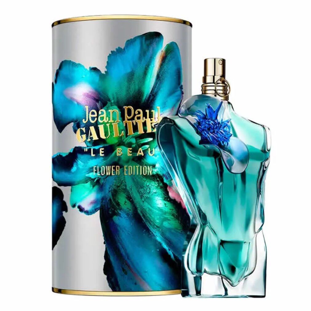 Flacon turquoise en forme de torse à côté d'un emballage cylindrique. Texte: Jean Paul Gaultier, Le Beau Flower Edition.