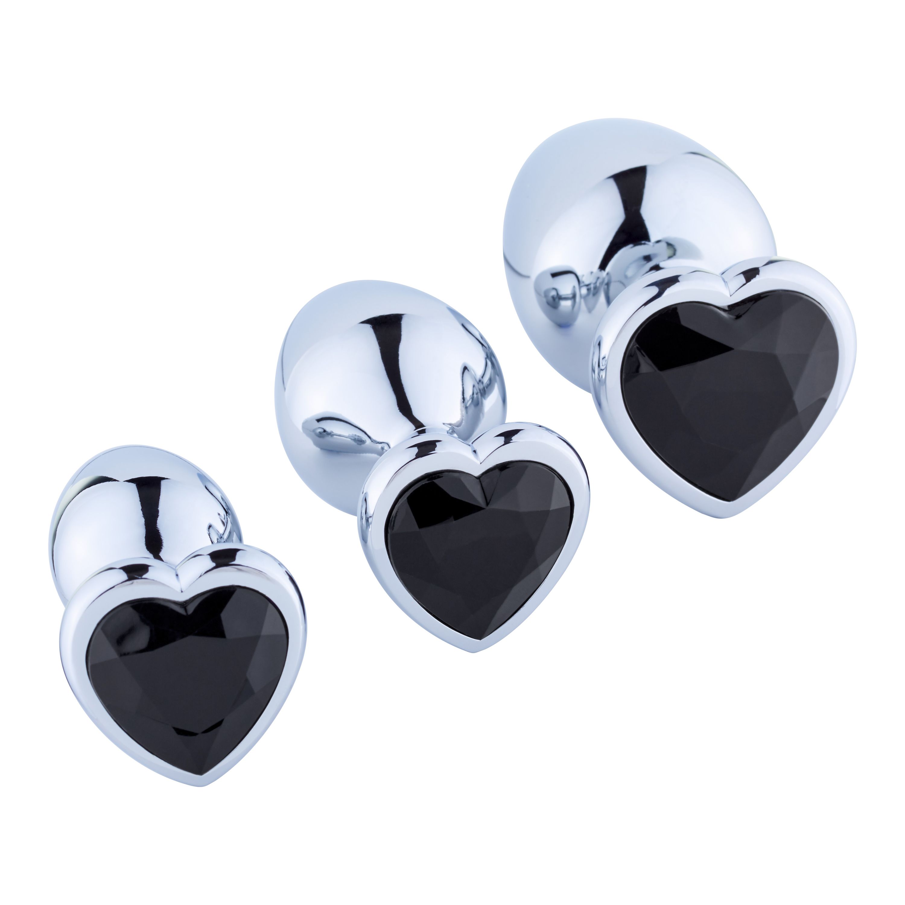 Drie anaal plugs met zwarte hartvormige edelstenen. Glanzend oppervlak, verschillende maten.