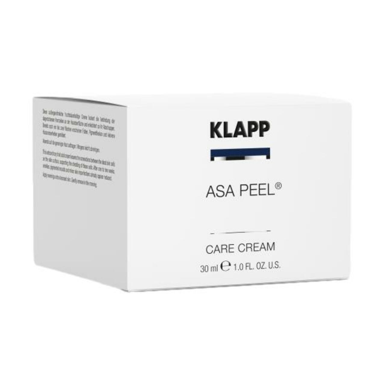 Witte productverpakking. Opschrift: KLAPP, ASA PEEL CARE CREAM, 30 ml, 1.0 FL. OZ. U.S. Tekst links.