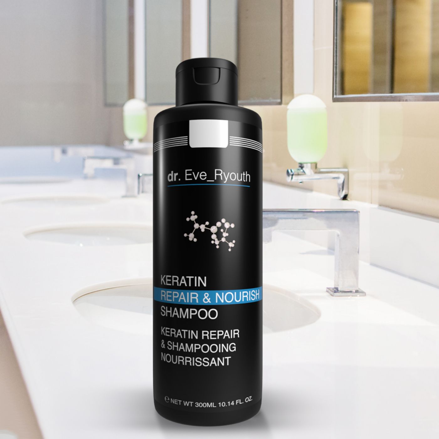 Zwarte shampoo fles met witte tekst. Opschrift: Keratin Repair & Nourish Shampoo. Staat op een wastafel.