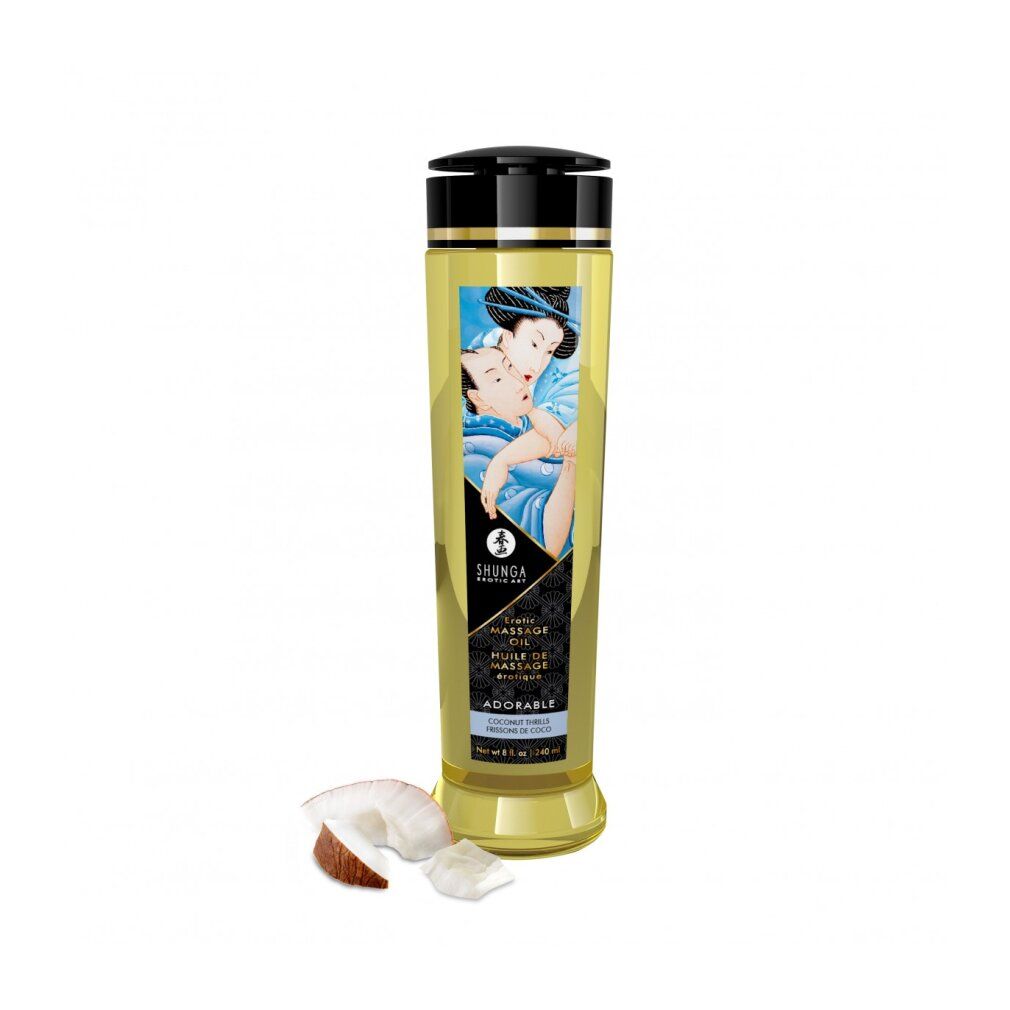Shunga massageolie fles met zwarte dop, label en stukken kokosnoot.