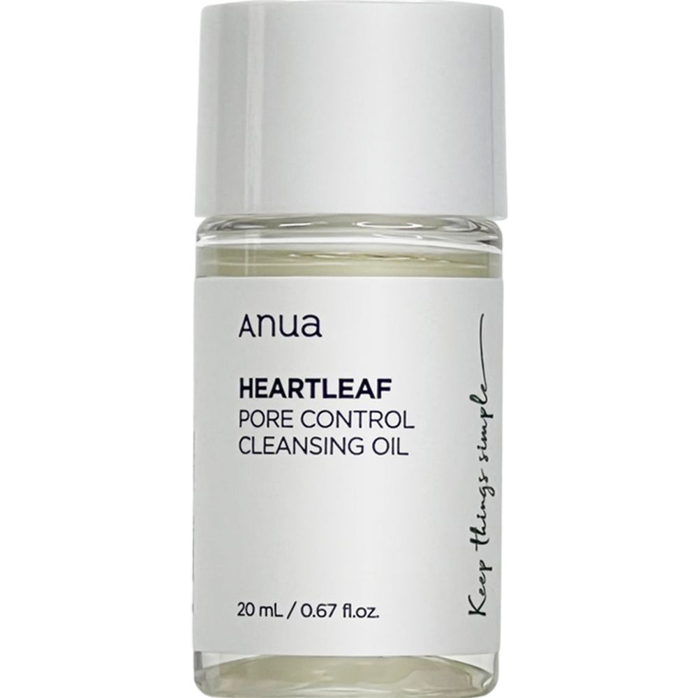 Flacon cylindrique transparent avec bouchon blanc. Contient un liquide clair. Étiquette : "anua HEARTLEAF PORE CONTROL CLEANSING OIL".