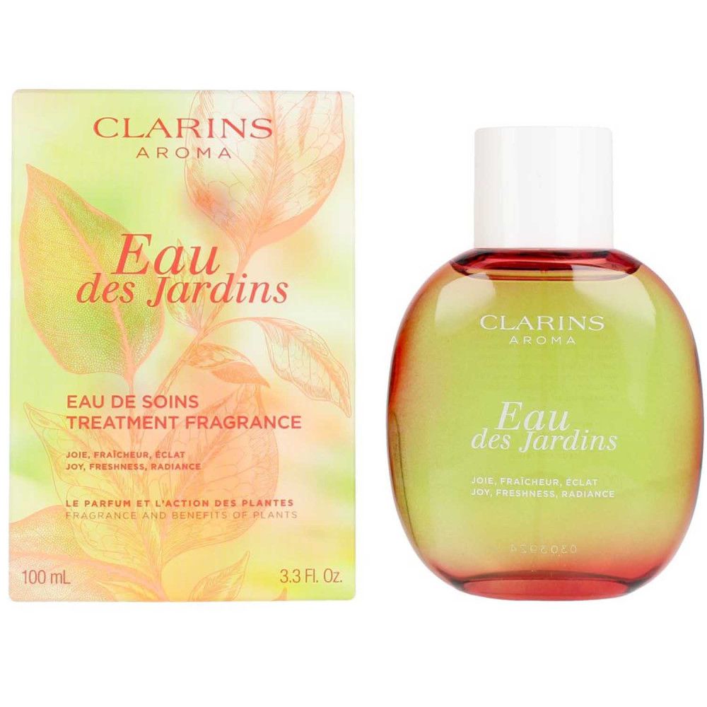 Fles en doos. Opschrift: Clarins Aroma, Eau des Jardins. Doos met bladeren en productinformatie.