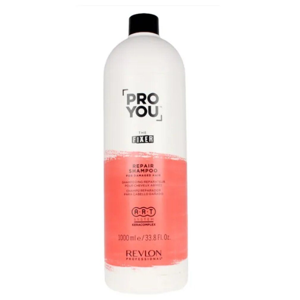 Witte fles met zwarte dop. Opschrift: Pro You The Fixer Repair Shampoo. Rode kleurvlak. Revlon Professional.