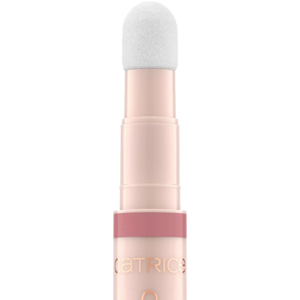 Lipolie-applicator met witte sponskop. Roze tube met opschrift "CATRICE COLOUR CUSHION JUICY LIP OIL".