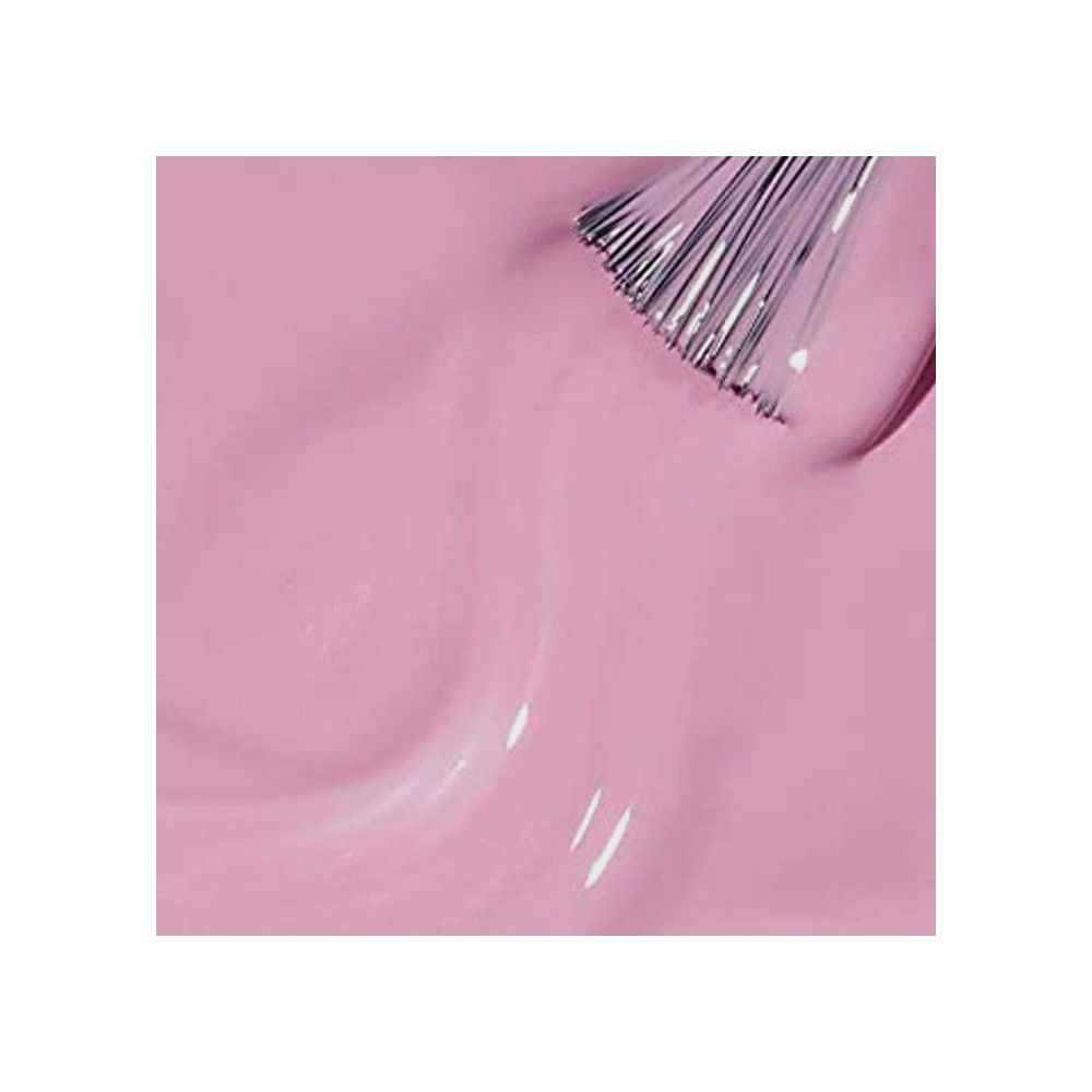 Roze nagellak met penseel. Close-up, glanzend oppervlak.