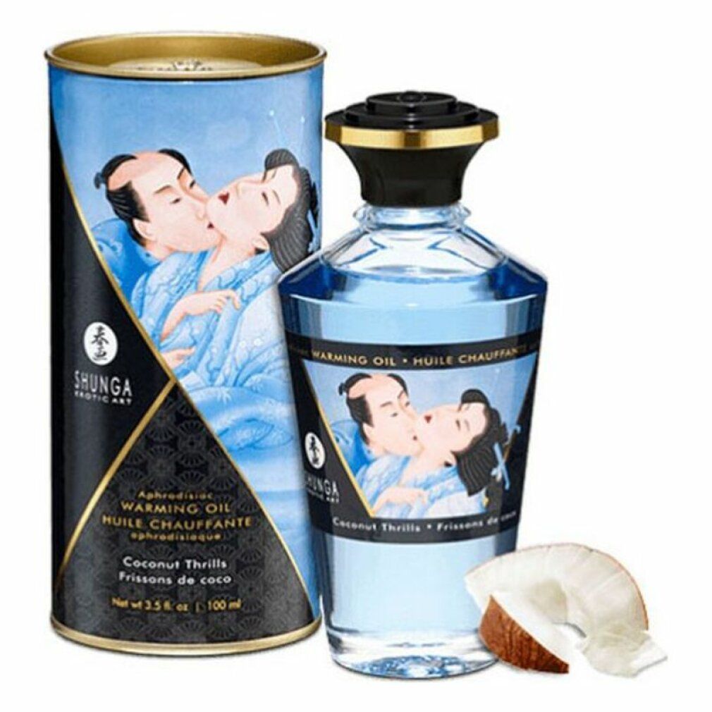 Flacon et boîte cylindrique bleus. Inscription: Shunga, Warming Oil, Coconut Thrills. Morceau de noix de coco.