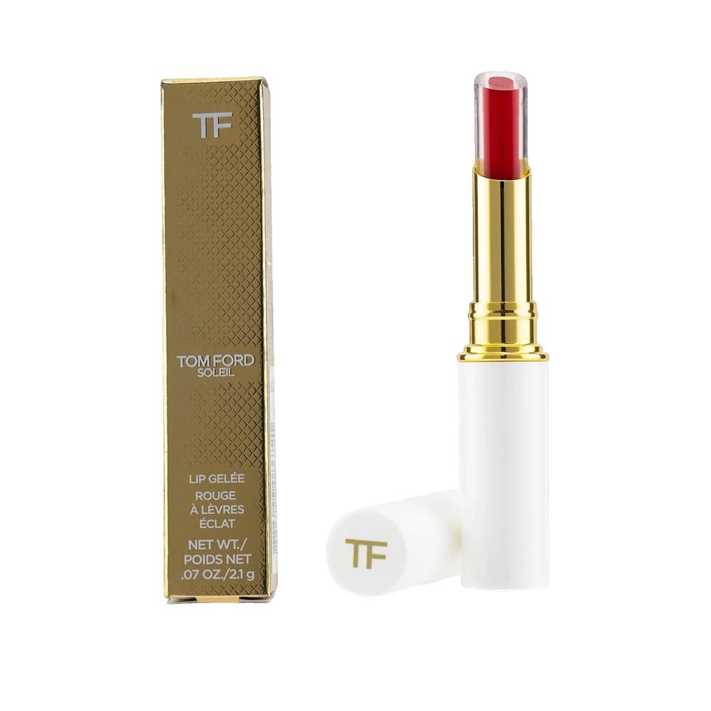 Rouge à lèvres rouge, corps doré et capuchon blanc. Emballage doré avec motif et texte de la marque.