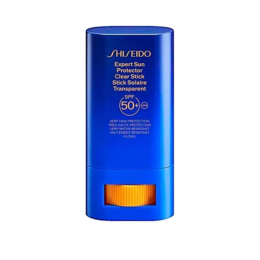 Stick solaire cylindrique bleu. Contient SPF 50+. Inscription : SHISEIDO, Expert Sun Protector, Clear Stick, Stick Solaire Transparent.