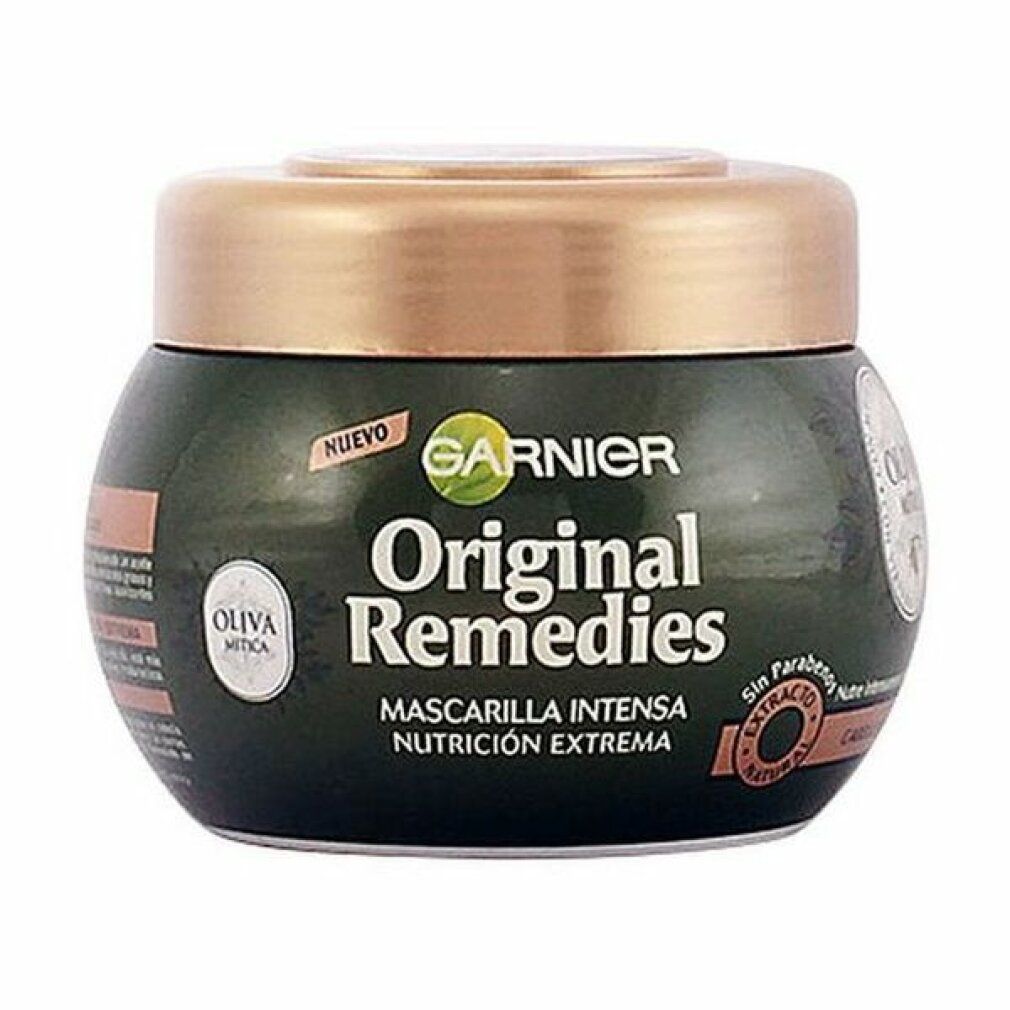 Pot vert foncé avec couvercle doré. Inscription: Garnier Original Remedies. Étiquettes avec informations sur le produit.