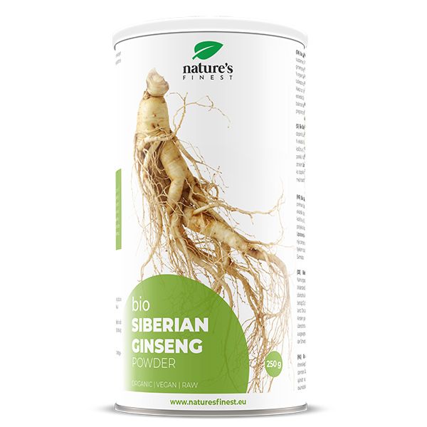 Boîte cylindrique avec racine de ginseng. Visible : logo de la marque, nom du produit, labels "Bio", "Vegan".