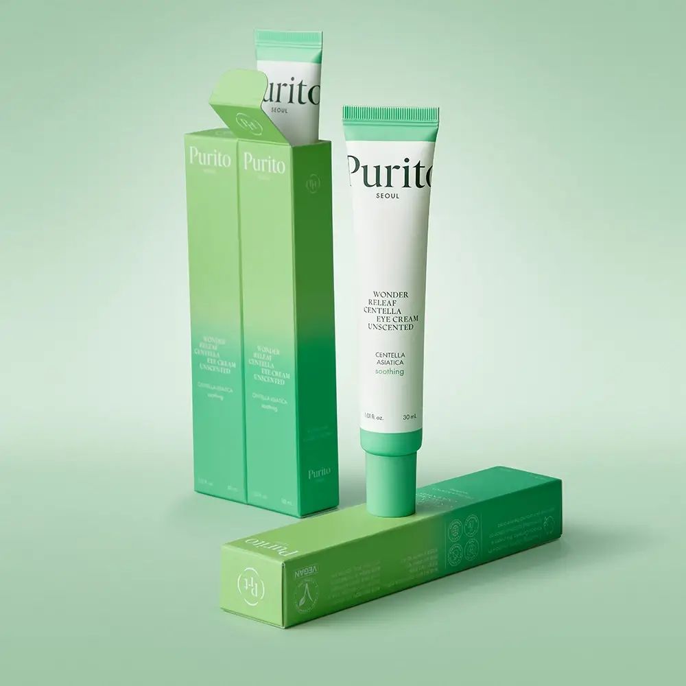 Emballage produit avec tubes et boîtes. Le tube est blanc avec des accents verts. Le texte indique : PURITO Wonder Releaf Centella Unscented Eye Cream.