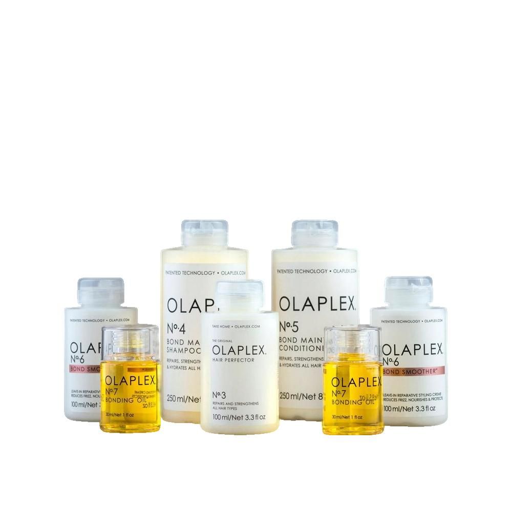 Plusieurs flacons et bouteilles. Inscription OLAPLEX, n° 3, 4, 5, 6, 7. Shampooing, après-shampooing et huile. Emballage blanc.