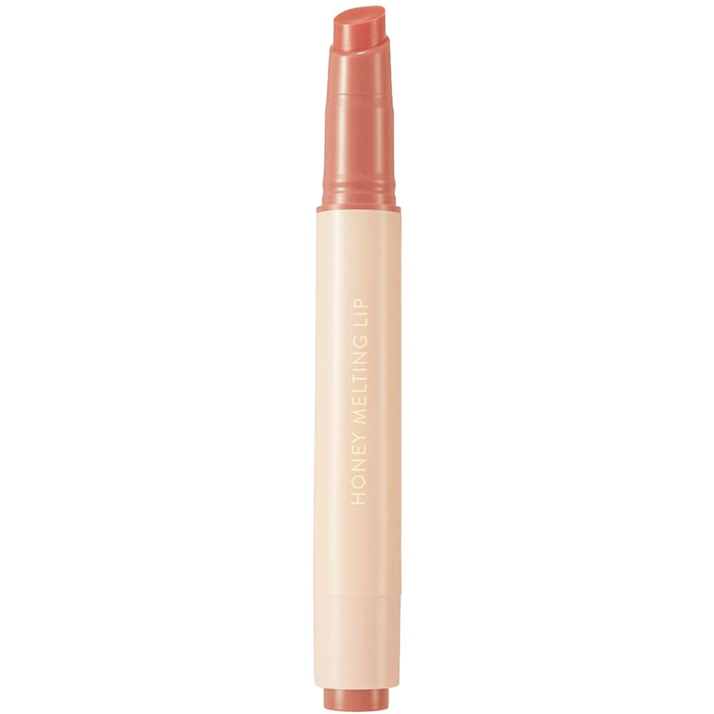Gloss à lèvres abricot. Bâton blanc-beige avec pointe abricot. Inscription: HONEY MELTING LIP.