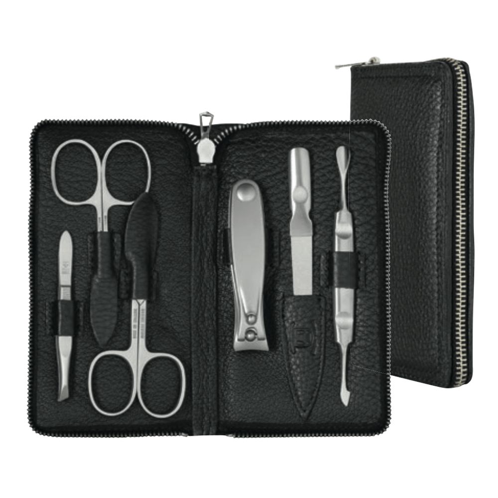 Étui en cuir noir contenant 6 instruments de manucure et pédicure en métal.