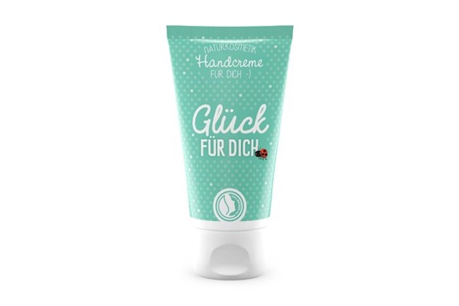 Tube de crème pour les mains turquoise avec bouchon blanc. Inscription : "Glück für Dich". Petits points et logo.