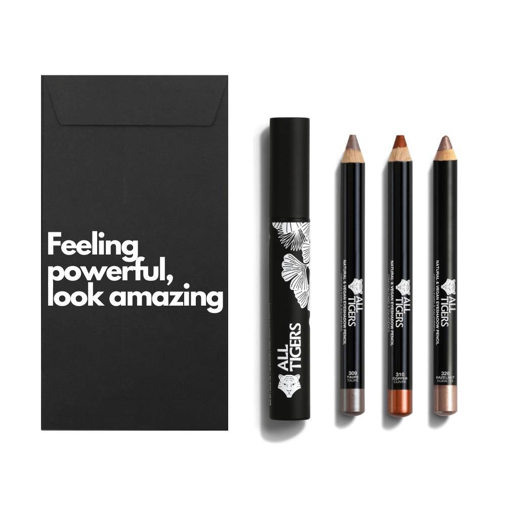 Zwarte verpakking met tekst. Mascara en drie oogpotloden. Merk ALL TIGERS.