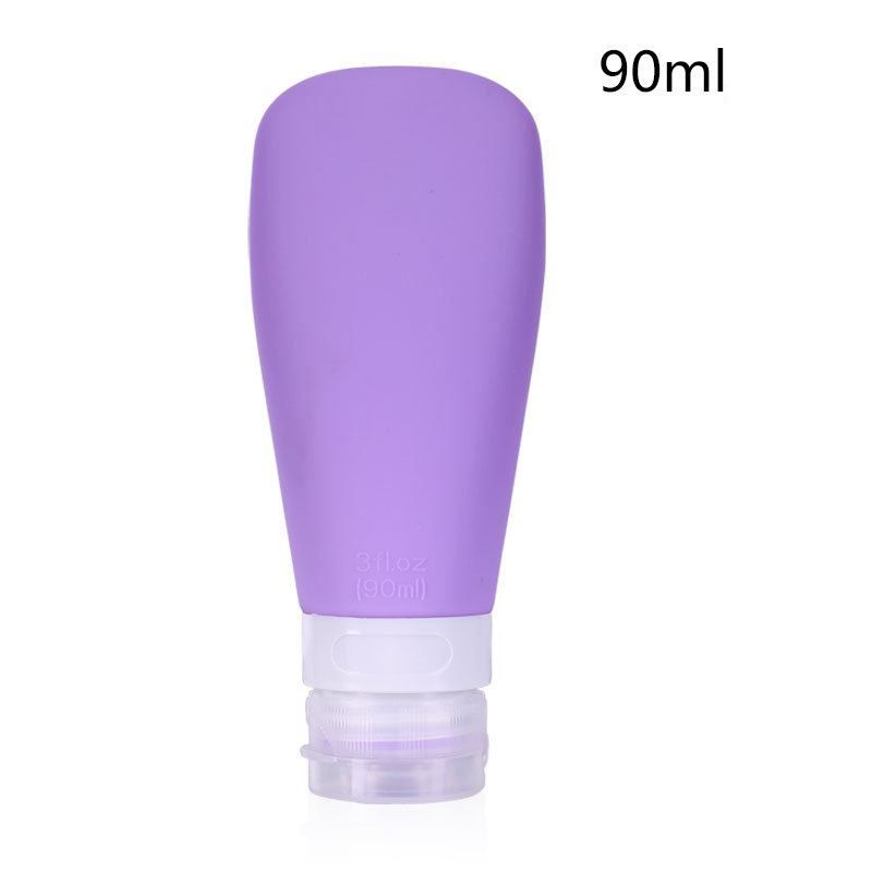 Een enkele paarse siliconen reisfles van 90 ml met witte en doorzichtige dop.
