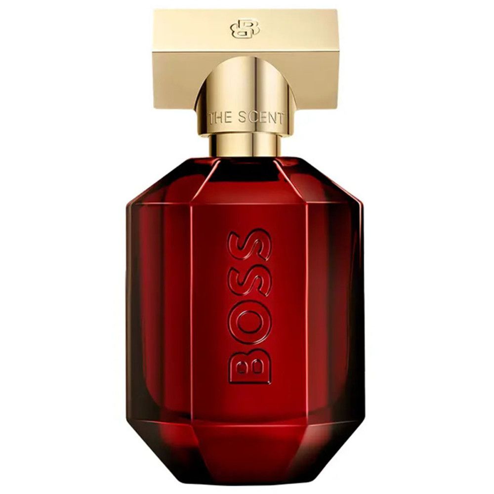 Rode glazen flacon met gouden dop. BOSS-opschrift op de voorkant. "THE SCENT" is zichtbaar op de dop.