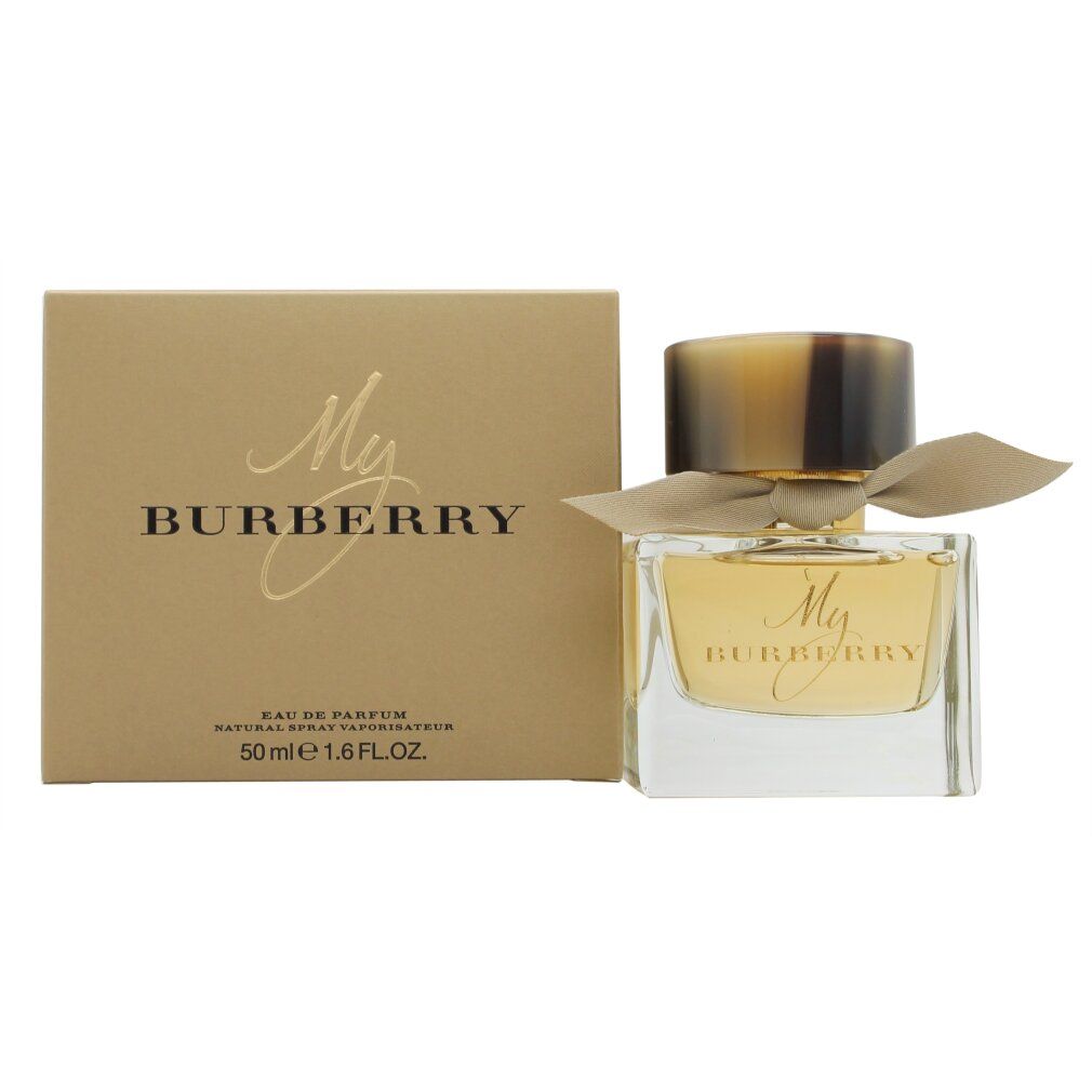 Parfumfles en doos. Fles met gouden dop en strik. Op de doos staat My Burberry.