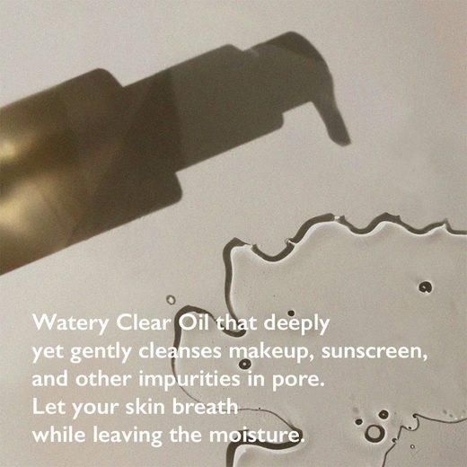 Olie op oppervlak. Tekst: Watery Clear Oil, reinigt make-up, zonnebrand. Laat de huid ademen en hydrateert.