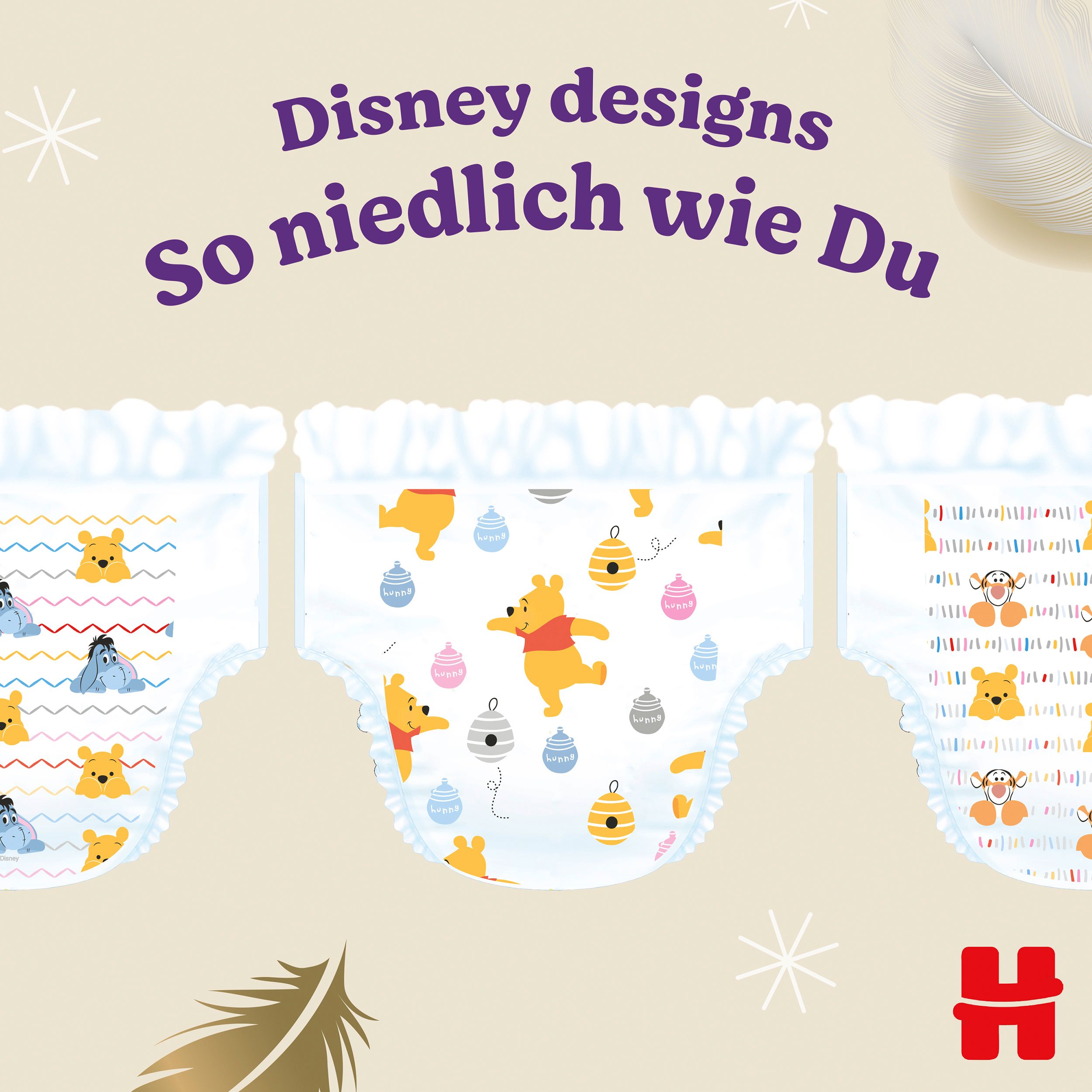 Drie Huggies Pants, maat 4, met verschillende Disney-designs, waaronder Winnie de Poeh en Knorretje.