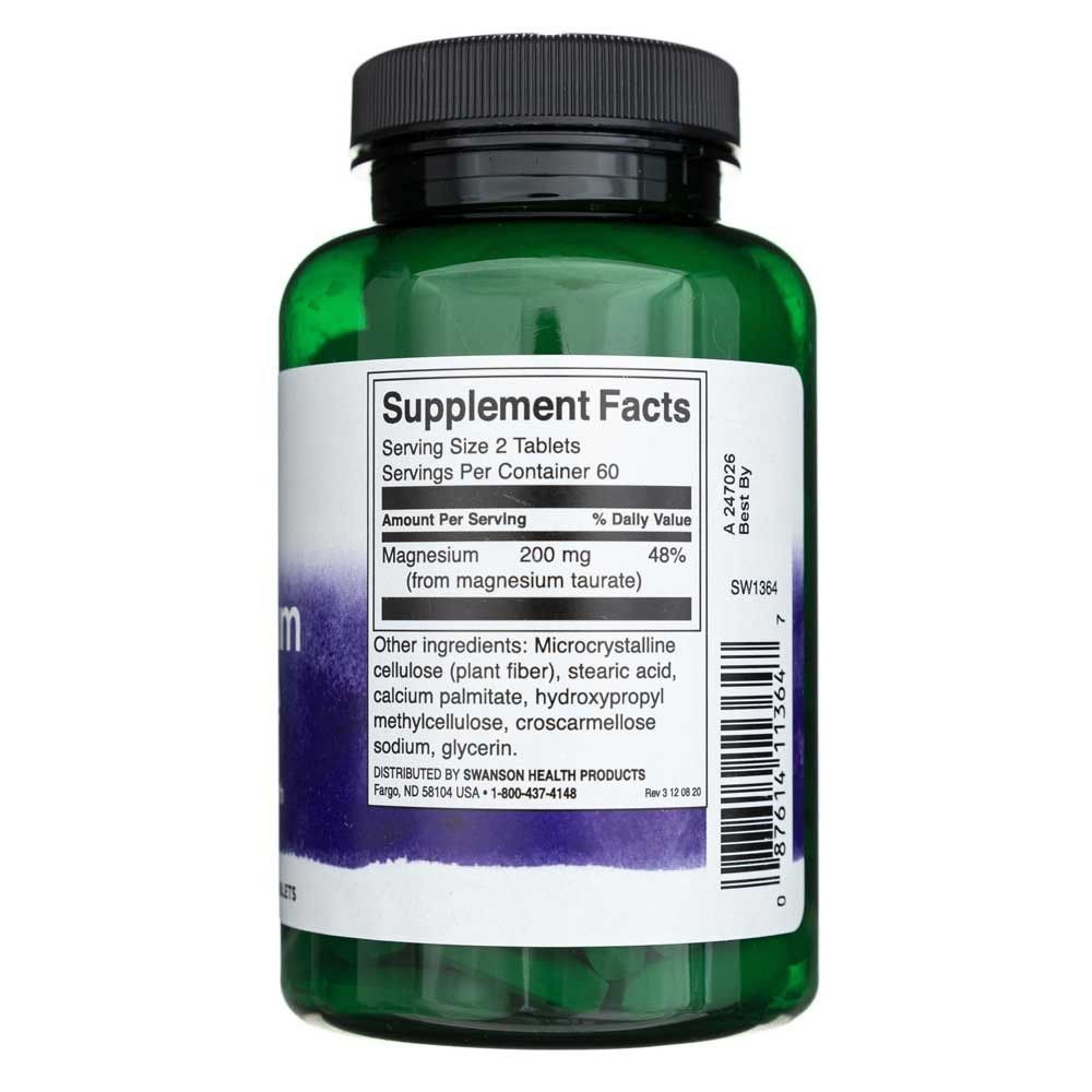 Groene supplementfles, etiket met "Supplement Facts" en magnesiuminformatie.