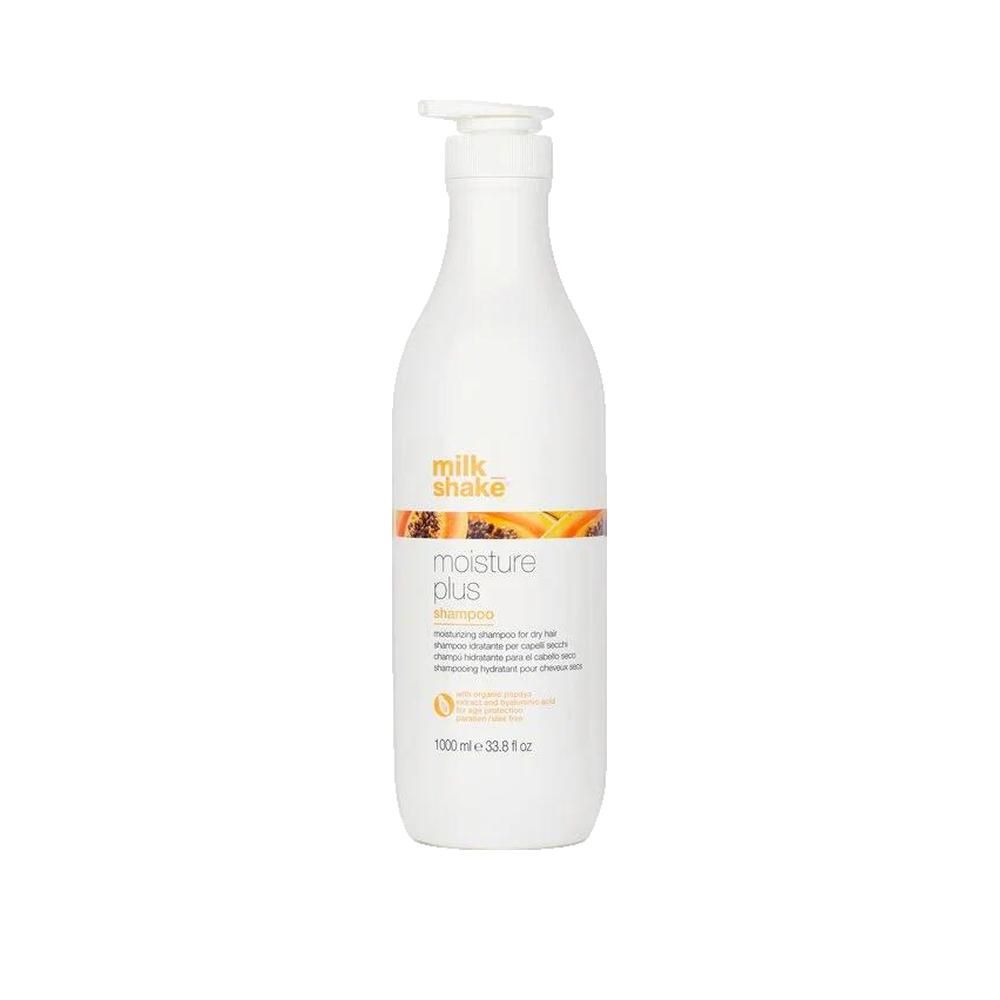 Flacon blanc avec pompe. Inscription: milk_shake, moisture plus shampoo. Bande orange avec illustration de papaye. 1000 ml.