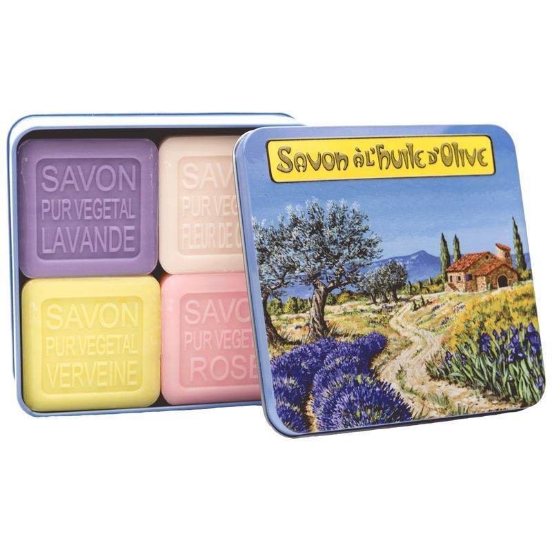 Boîte métallique ouverte avec savons colorés. Boîte avec paysage et inscription.