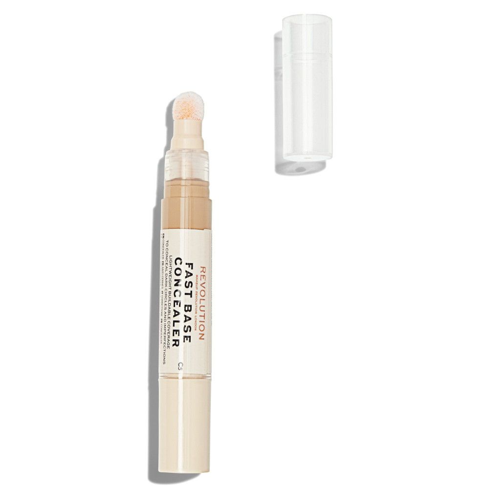 Concealer beige avec applicateur éponge et capuchon détaché. Inscription: Fast Base Concealer.