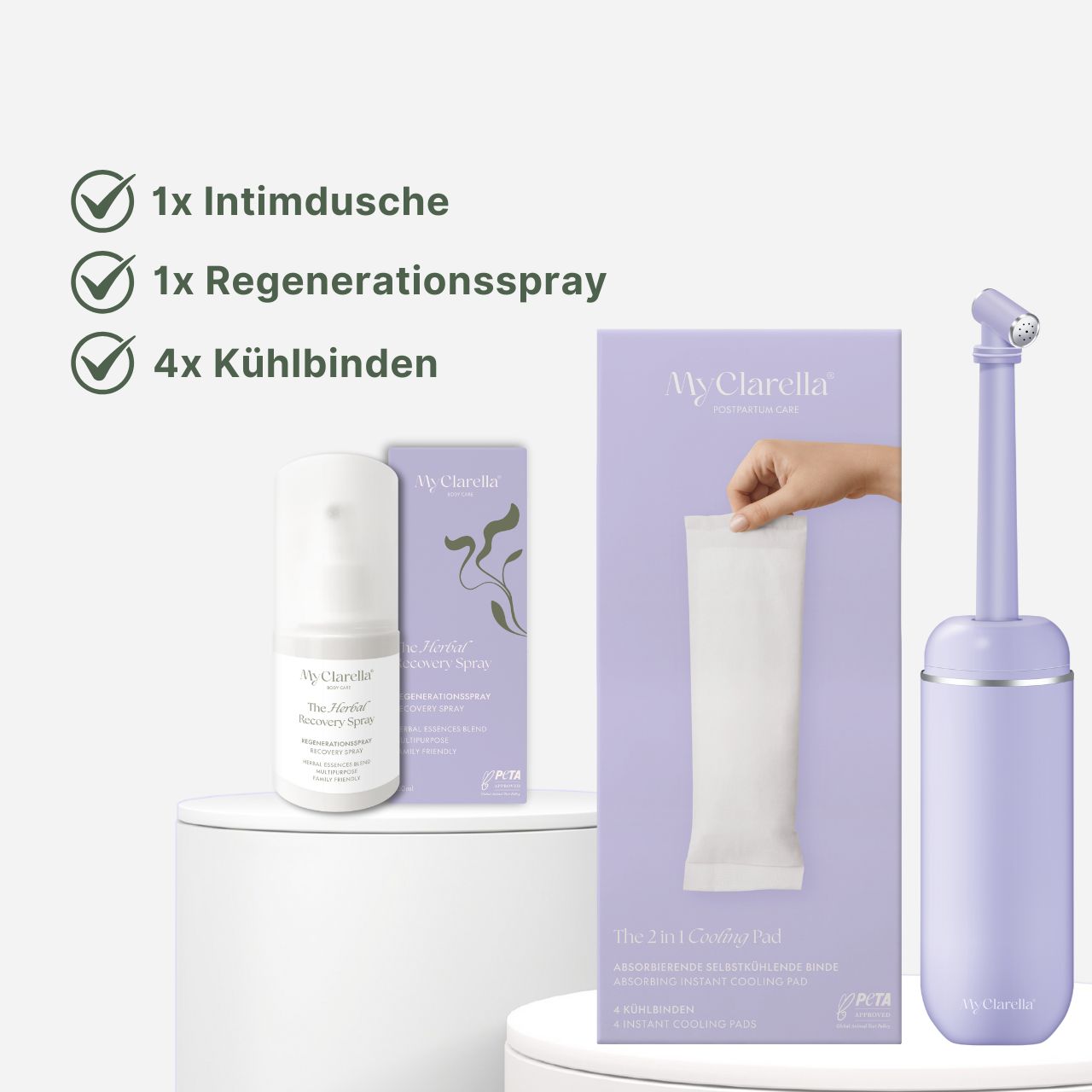 Set met intieme douche, regeneratiespray en koelverbanden. Producten op witte sokkel. Paarse verpakking met productnaam.