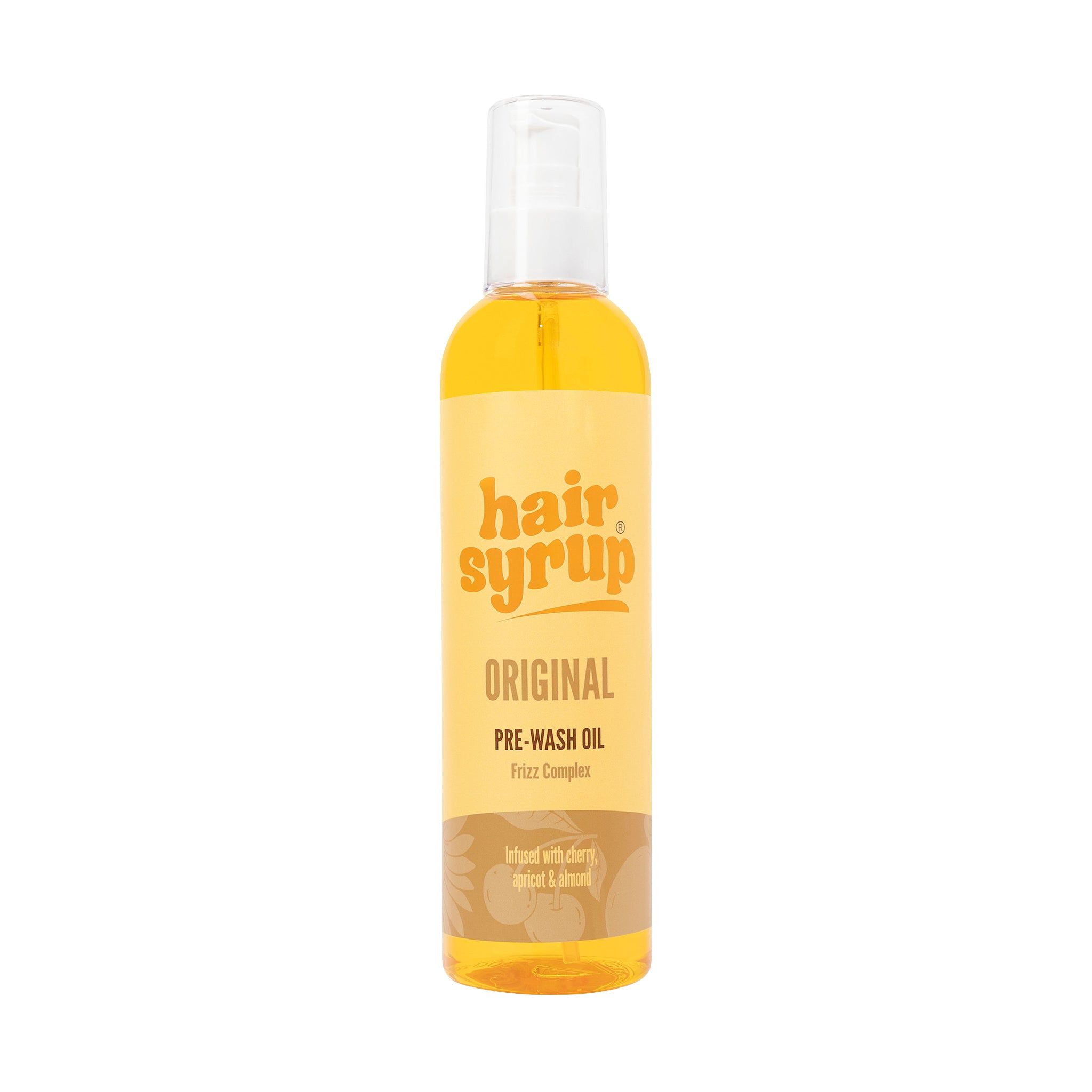 Bouteille Hair Syrup Original. Inscription: Pre-Wash Oil. Sur fond jaune.