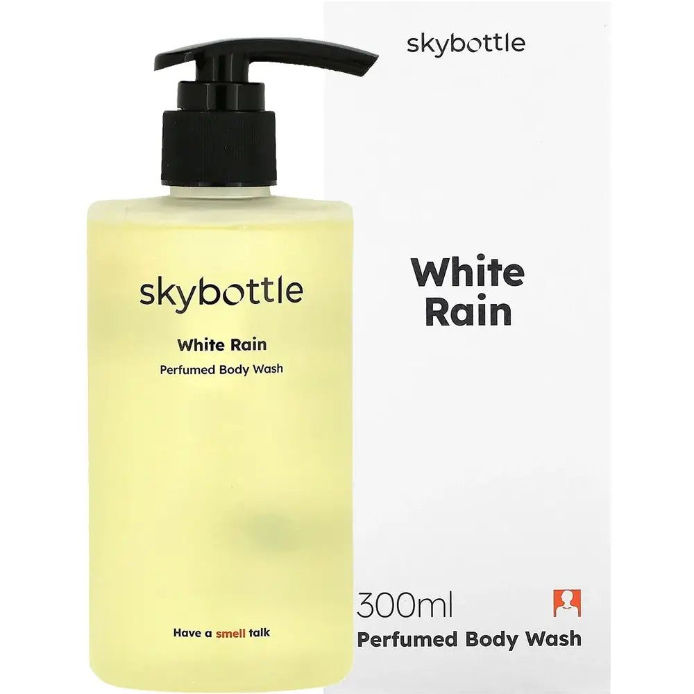 Fles SKYBOTTLE White Rain douchegel met zwarte pomp, naast witte verpakking.