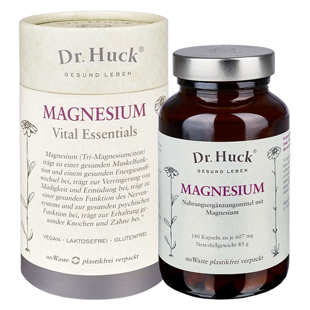 Bruine glazen fles en kartonnen doos met "Dr. Huck Magnesium". Opschrift: "140 capsules". 