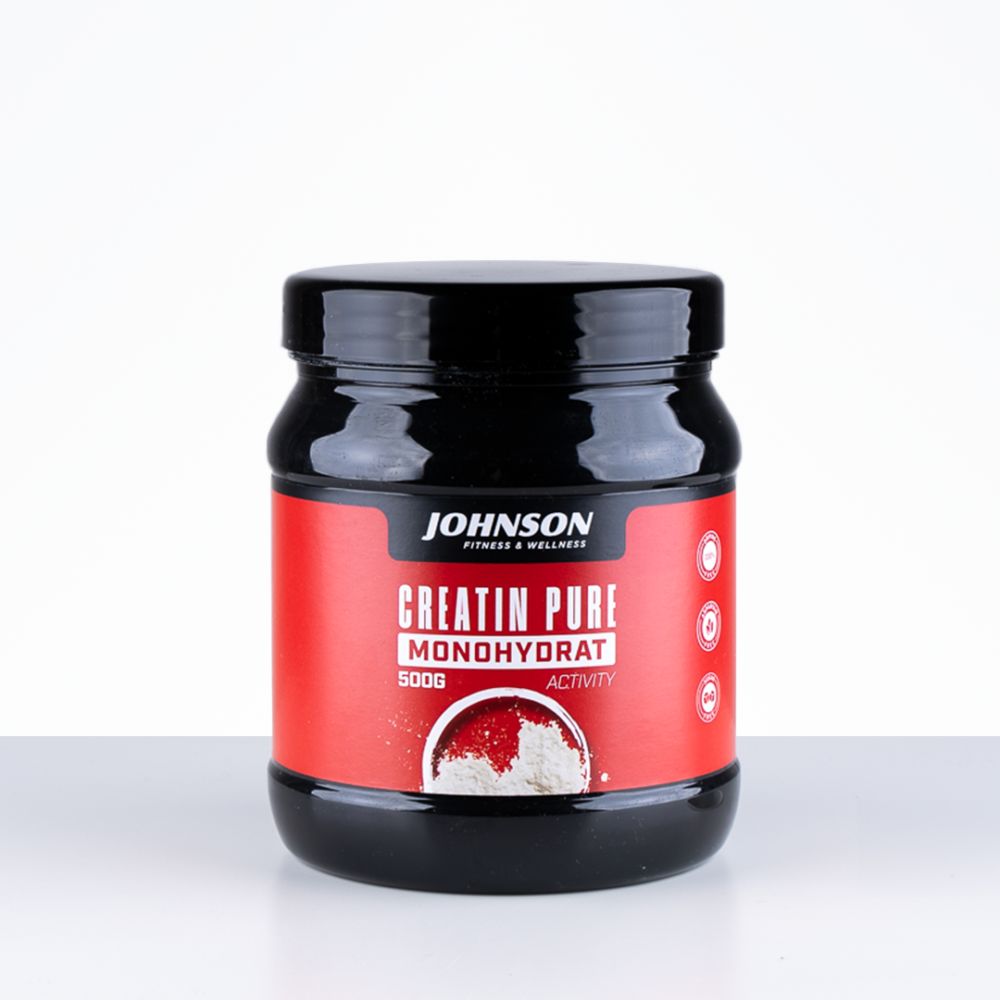 Pot noir avec étiquette rouge. Contient 'Creatin Pure Monohydrat' et '500g'. La marque 'Johnson' est visible.