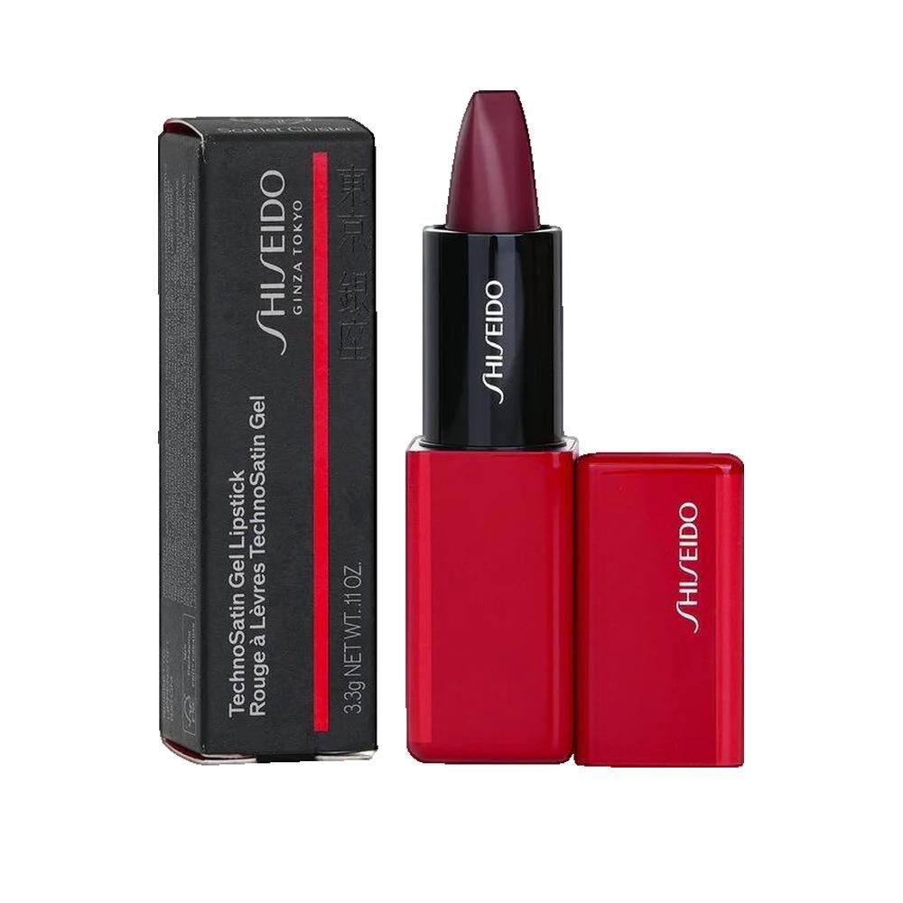 Rouge à lèvres avec capuchon ouvert et emballage noir. "SHISEIDO" est écrit sur l'emballage.