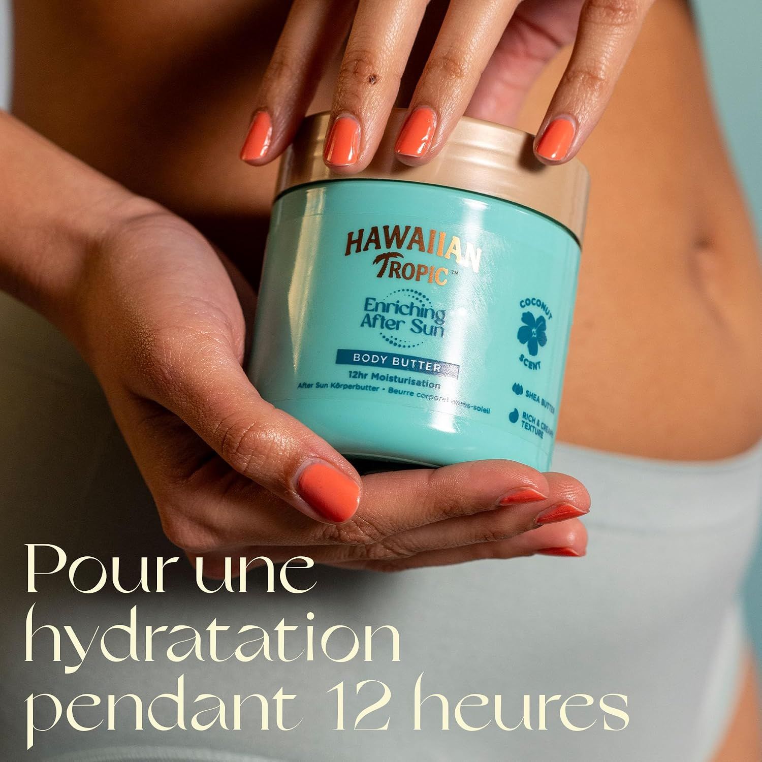 Hawaiian Tropic Body Butter, hydratation 12h, dans un pot turquoise.