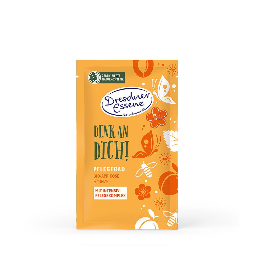 Gele productverpakking met tekst. Dresdner Essenz, verzorgingsbad Bio-Abrikoos & Munt. Gecertificeerde natuurlijke cosmetica.