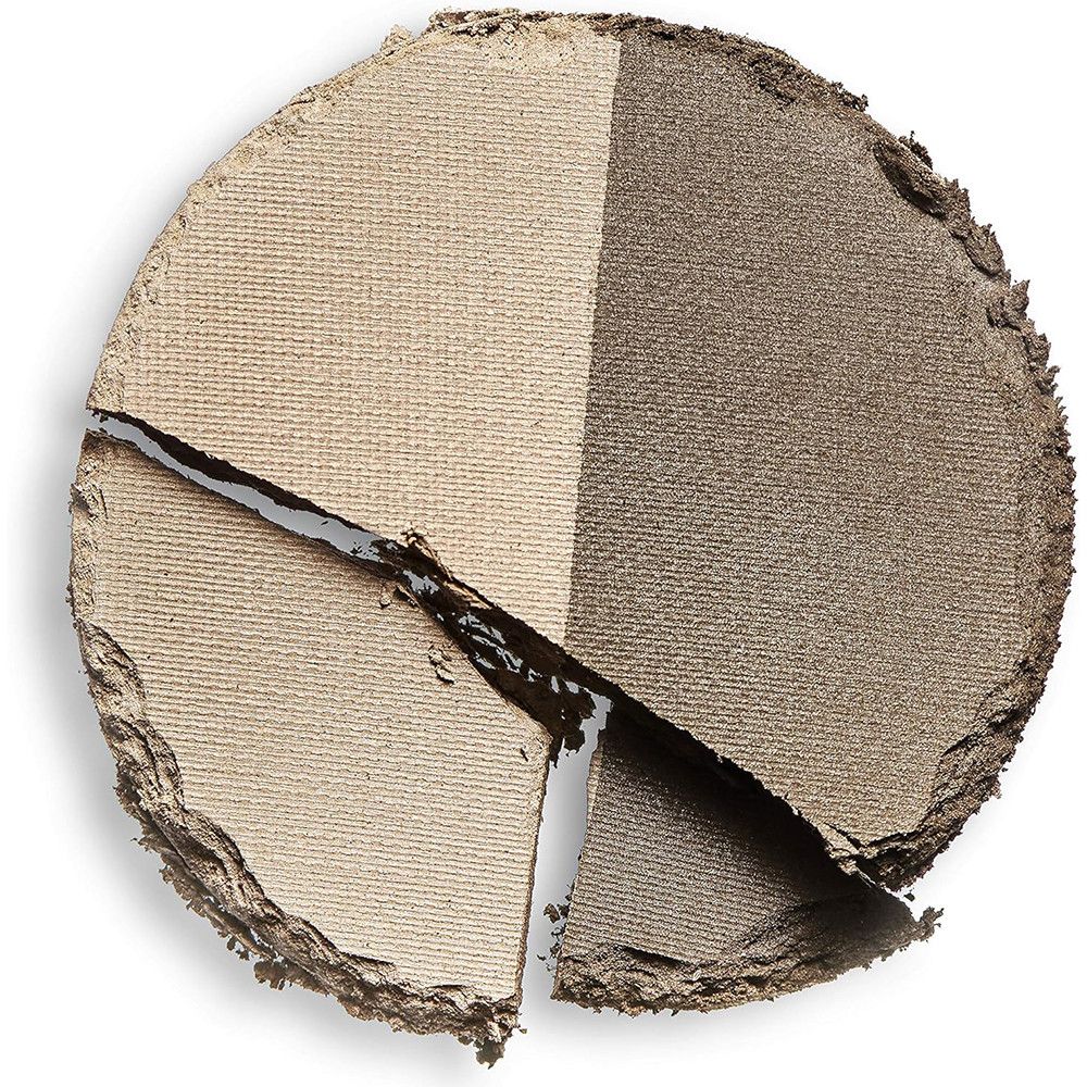 Poudre à sourcils ronde, divisée en deux. Une moitié claire, l'autre foncée. Endommagée, avec des fissures.