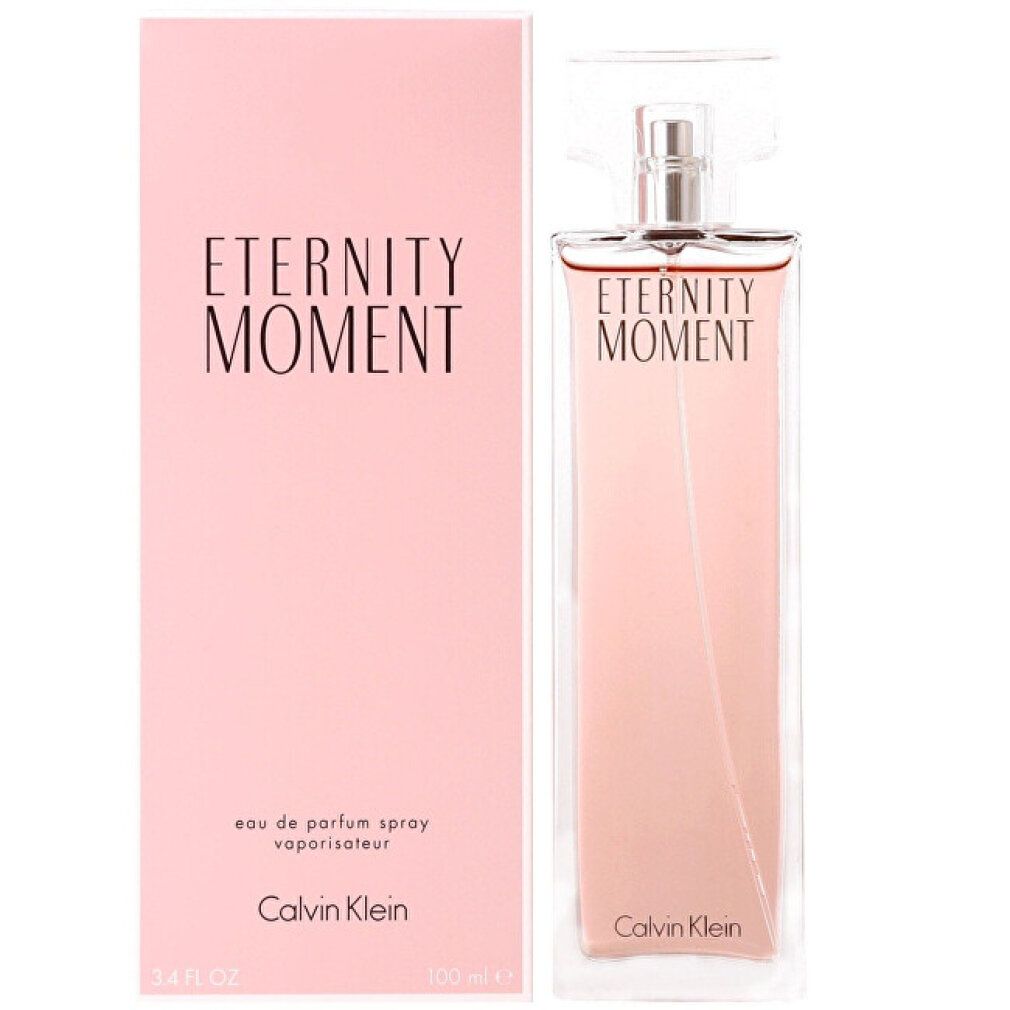 Flacon et emballage. Flacon rectangulaire, liquide rose. Emballage rose, inscription "Eternity Moment". Marque Calvin Klein.