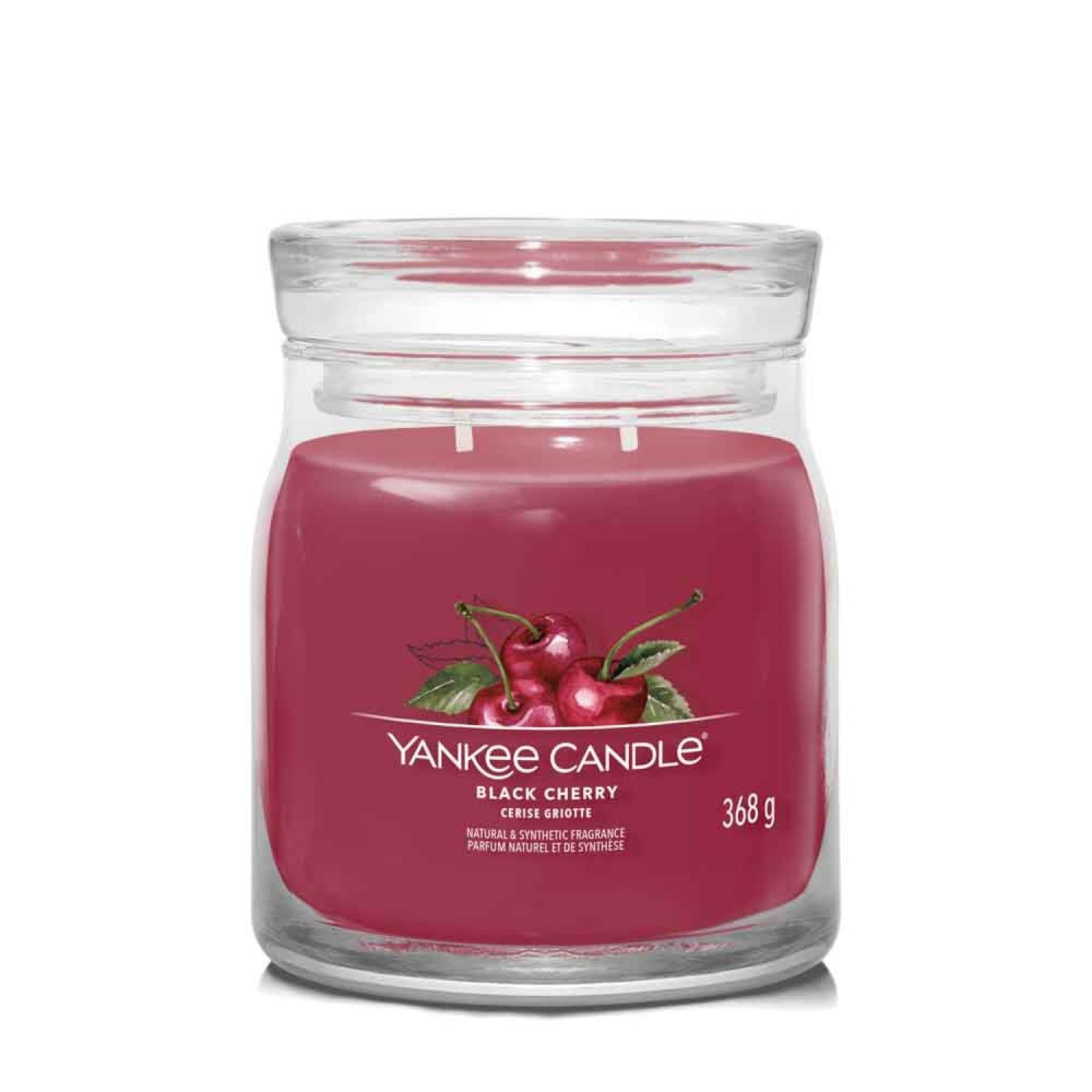 Bougie parfumée rouge en verre avec couvercle. Étiquette cerise, 368g. Deux mèches. Yankee Candle.