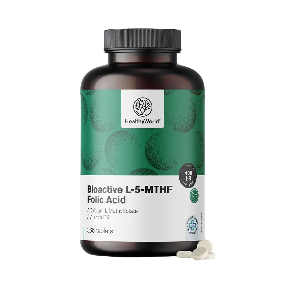 Flacon brun de comprimés. Inscription: HealthyWorld, Bioactive L-5-MTHF Folic Acid. 365 comprimés. Quelques comprimés à côté.